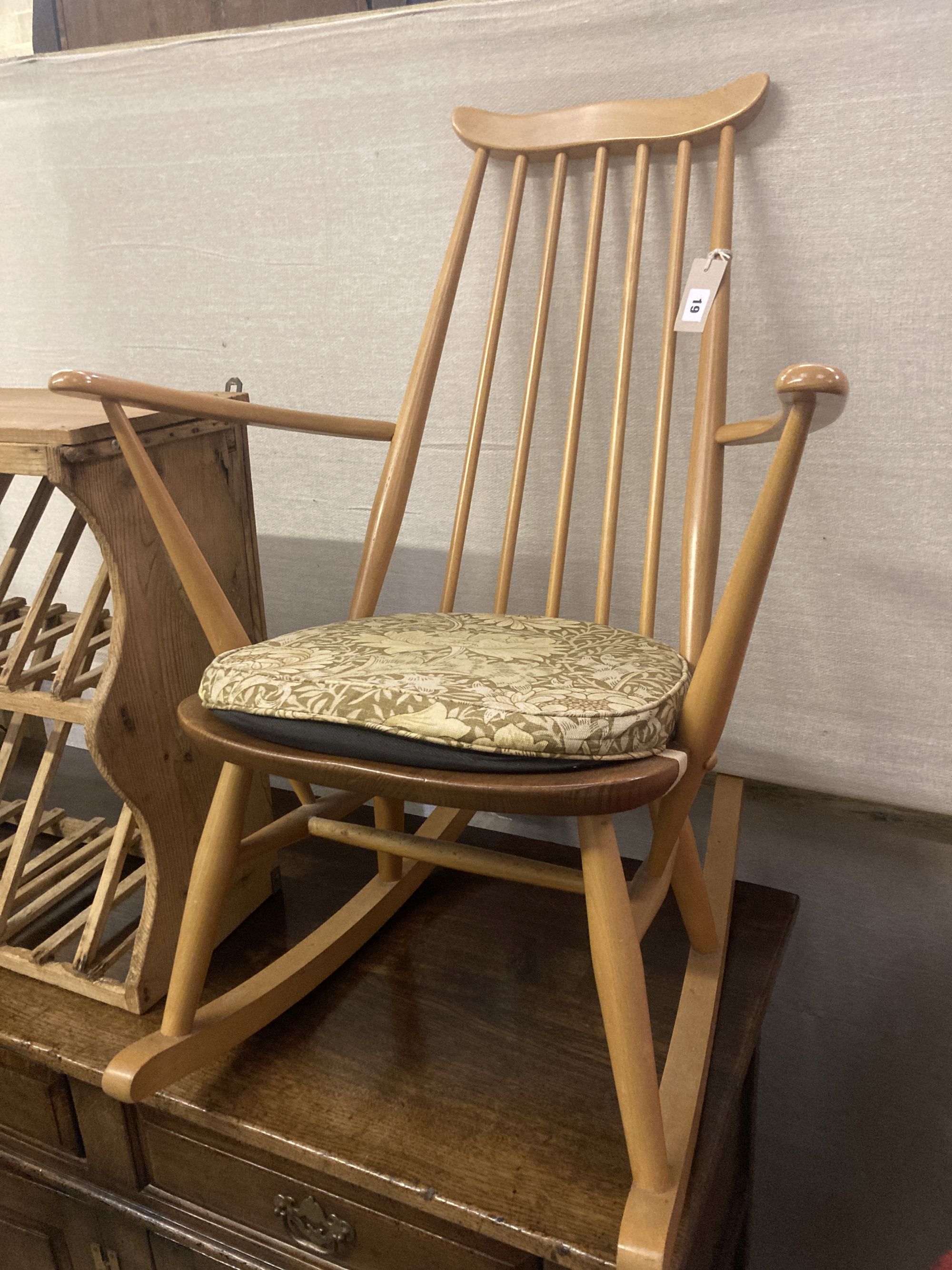 An Ercol stickback beech rocking chair